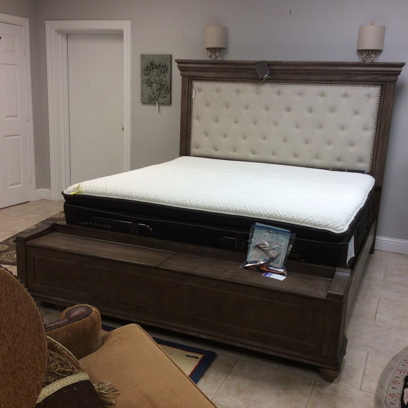 This bed by Ashley Furniture is gorgeous! It's a King/California King, the set includes the headboard, footboard and frame. The headboaed includes a  soft, cream, tufted upholstery and the footboard features 2 roomy storage spaces. Painted a farmhousy gray and distressed for that timeless, weathered look - it's lovely! Come take a look, it won't be here long!
