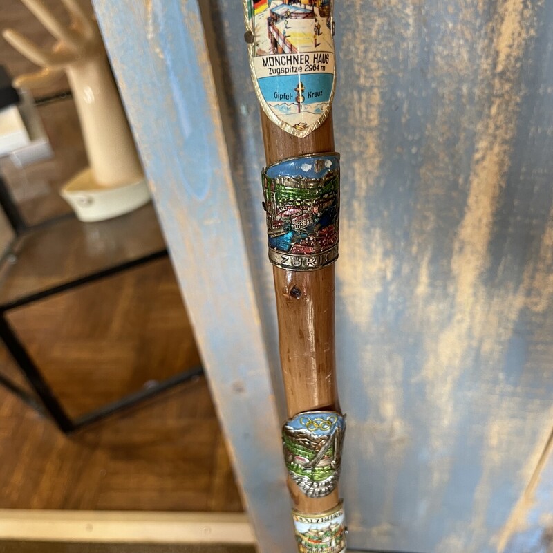 Vtg. German Walking Stick,
Size: 34
This bamboo cane comes with 6 metal badges of the places it has travelled.
Excellent condition
