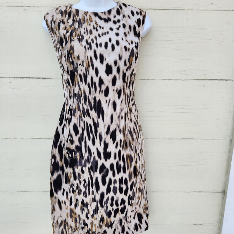 Carolina Herrera sleeveless jacquard animal print with round neckline Dress. It is knee-length and has a back zip closure with an interior clasp.<br />
Size 12<br />
Pit to Pit 18 inches across<br />
Waist 16.5 inches across<br />
Hips 21 inches across<br />
Neckline to bottom on the dress at the back 37.5 inches<br />
Hidden back zipper with hook & eye<br />
Back middle slit 6 inches<br />
two small (wine) spots on Lining<br />
Dress has been Washed