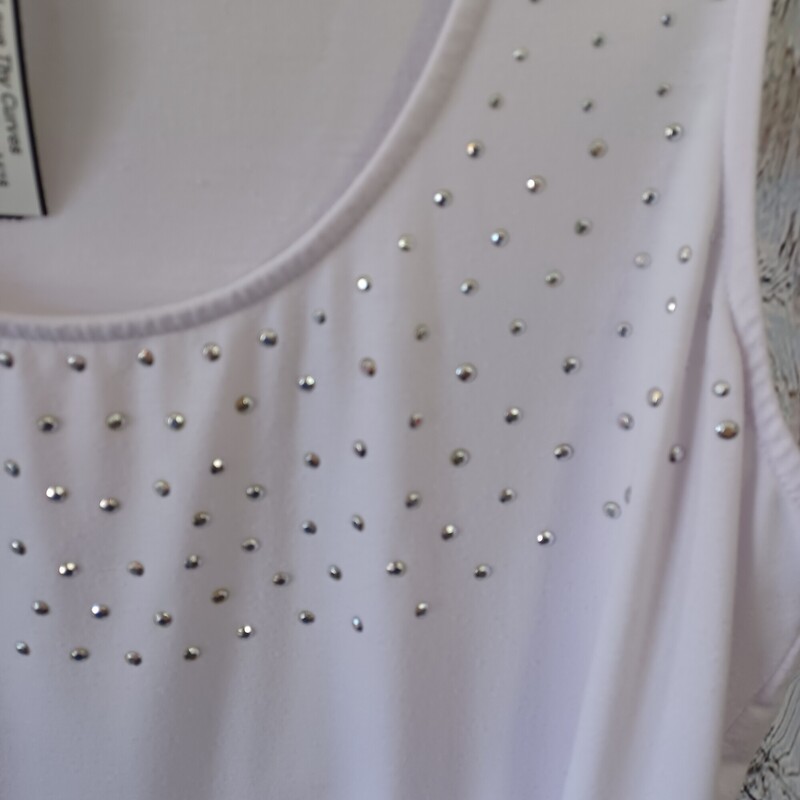 Basic white tank but adorned on the chest with mettalic studding.