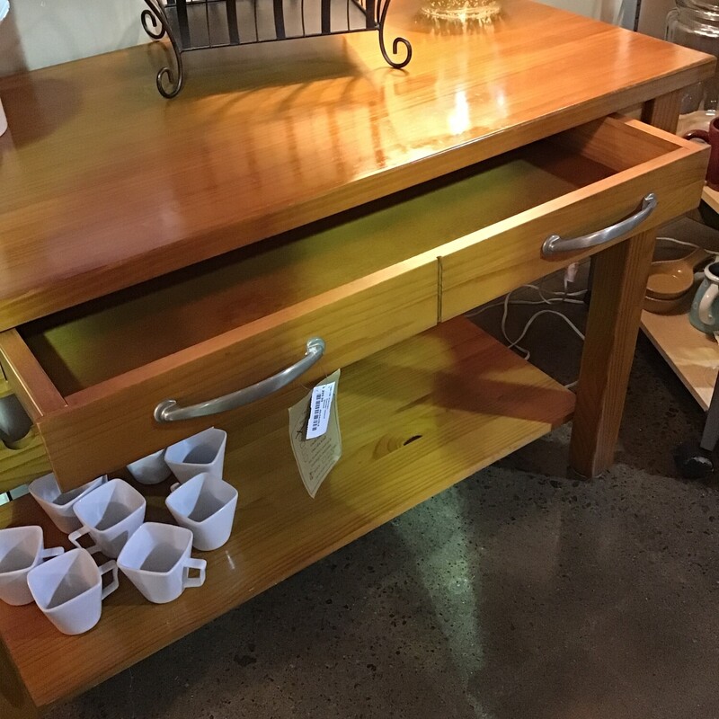 Center Island<br />
Finished on all four sides<br />
Long drawer with double silver pulls<br />
Holds 10 wine bottles<br />
Long lower shelf<br />
Towel bar on side<br />
Four sturdy straight legs<br />
<br />
Dimensions: 48x24x32.5