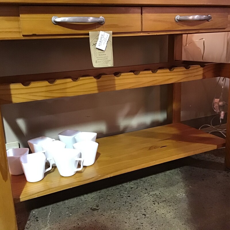 Center Island<br />
Finished on all four sides<br />
Long drawer with double silver pulls<br />
Holds 10 wine bottles<br />
Long lower shelf<br />
Towel bar on side<br />
Four sturdy straight legs<br />
<br />
Dimensions: 48x24x32.5