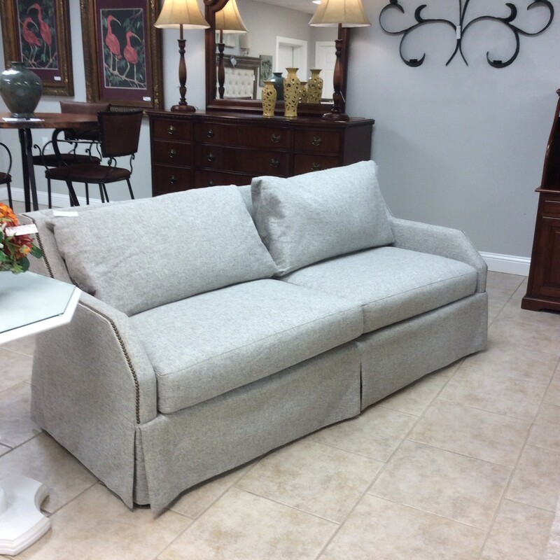 This is a beautiful sofa by Sherrill Furniture. Modern in design, it's upholstered in a luscious oatmeal and features a bold nailhead trim. Great condition!