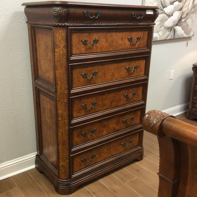 This is a lovley, traditionally styled Gentlemen's Chest by Aspenhome. It features intricate carved details and both sides open up for more storage.