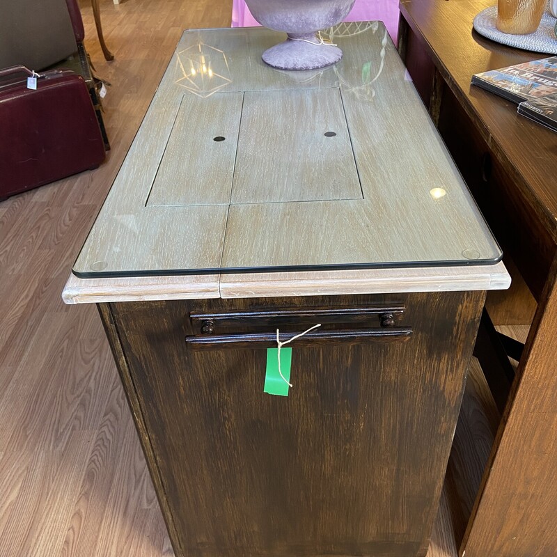 Repurposed Sew Machine Desk<br />
<br />
Beautiful Details: new glass top, storage underneath, and casters.<br />
<br />
Size: 41x20x30