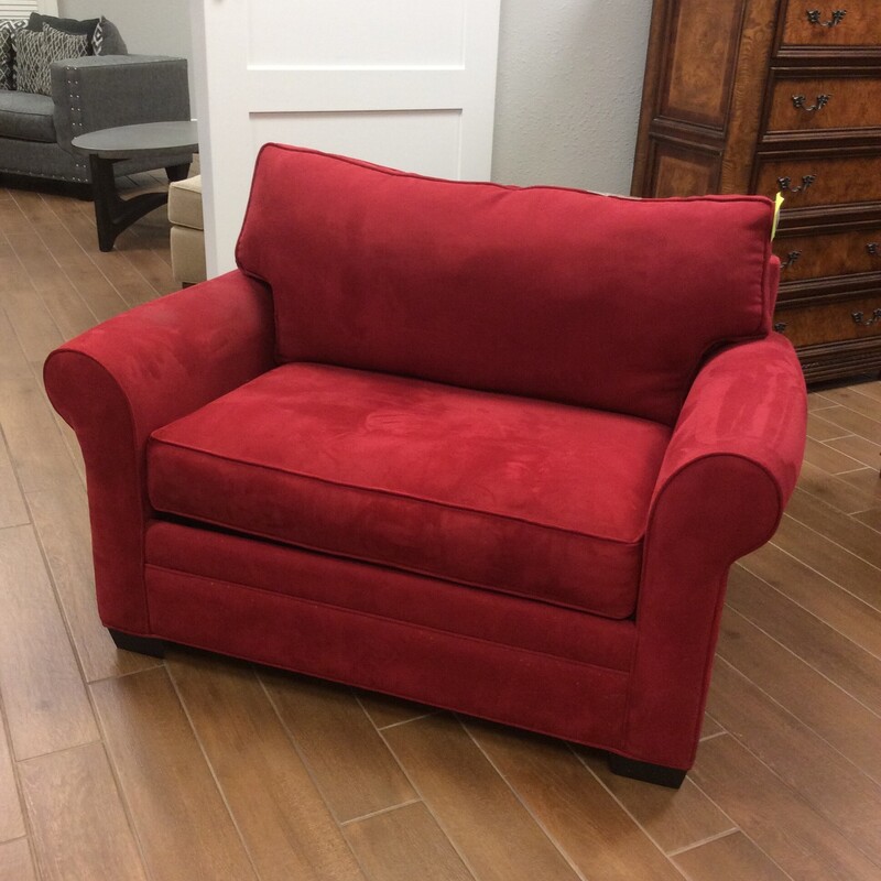 This Twin Sleeper Loveseat is upholstered in a rich red microfiber material and opens up into a twin size bed.
