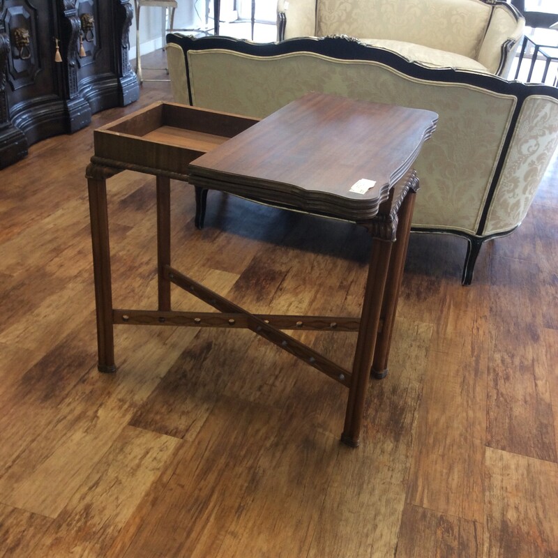 This antique cherry entry / game table ahs a folding top that converts from an entry table into a square game table.