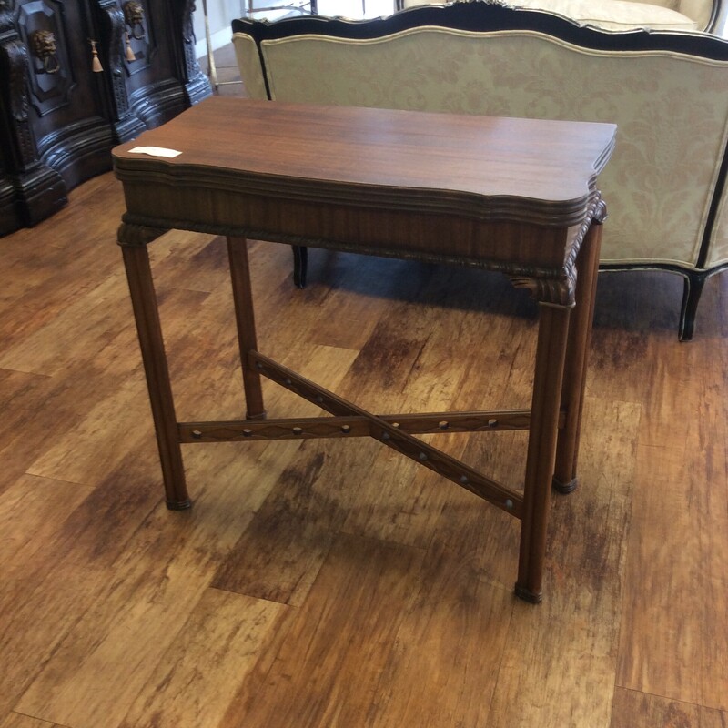 This antique cherry entry / game table ahs a folding top that converts from an entry table into a square game table.