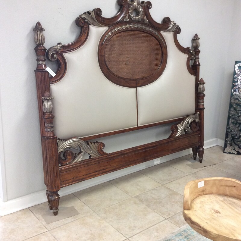 This is a very beautiful Jeff Co. head and foot board. The head board has a wicker detail and leather backing.  This consigner had the bed faux painted with a goldish-silver color.