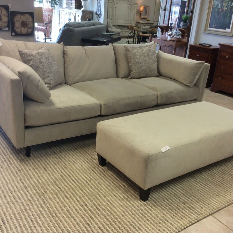This is a beautiful cream fabric Z-Gallerie sofa and ottoman. This sofa has wooden legs and comes with side support pillows and 2 decorative pillows.