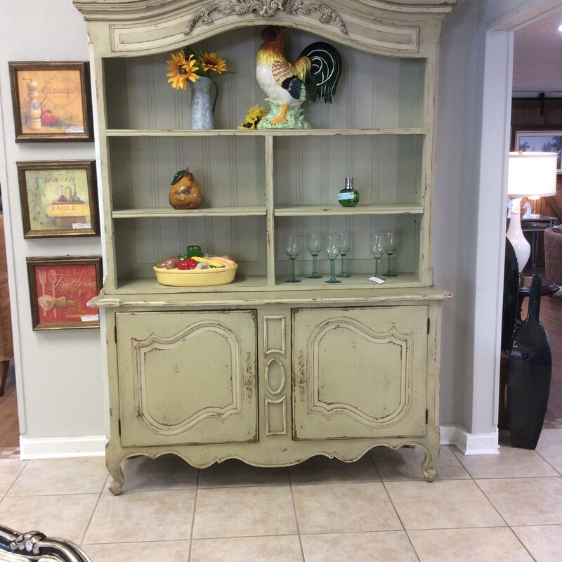 This is a beautiful light green, shabby chich, Heritage Collection 2 piece Hutch. This hutch has 2 under cabinets with 1 shelf in each and 5 shelfs on the top piece of the hitch. The Hutch was bought from Laurie's.