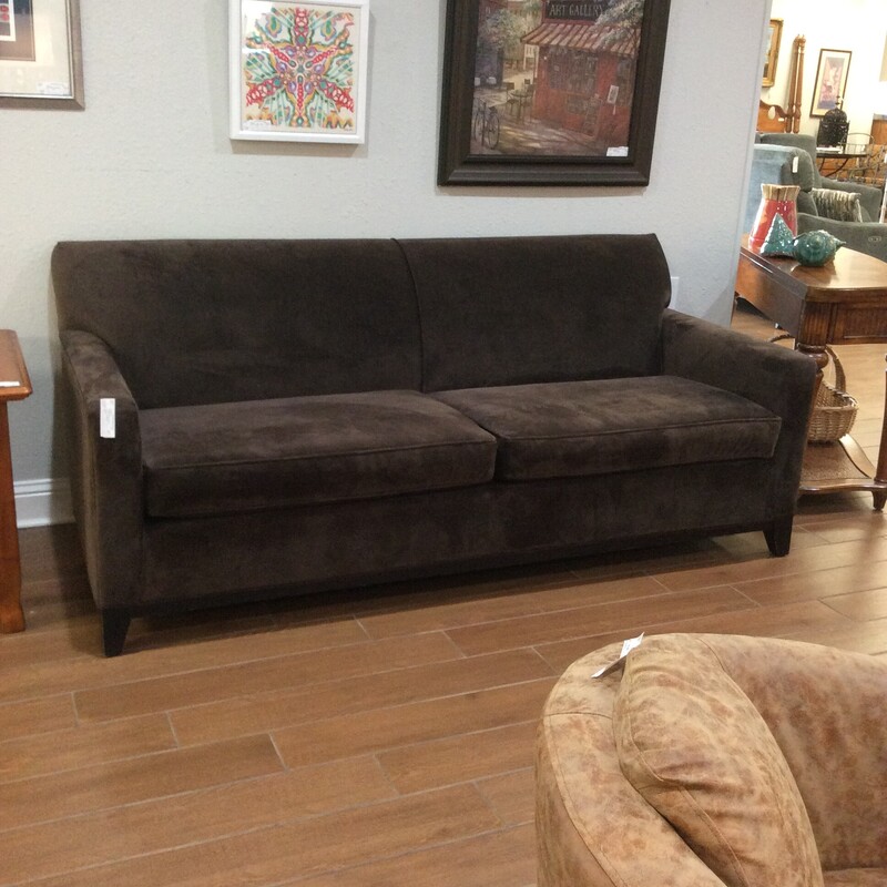 This pretty upholstered sofa is from Rowe Furniture. Modern in design, it features cool, clean lines but the rich, dark brown fabric warms it up perfectly!