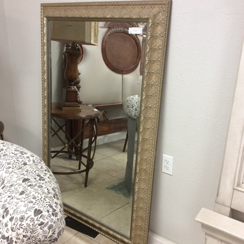 This is a beautiful gold framed, beveled mirror. This mirror is large and has a good weight to it.