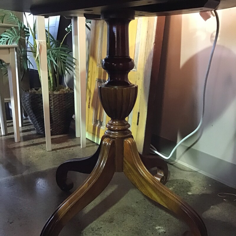 This pretty round accent table from Ethan Allen features a medium wood tone and a 3 legged base. There are a couple of wear marks on the top of the table.

Dimensions are 30 in x 29 in.