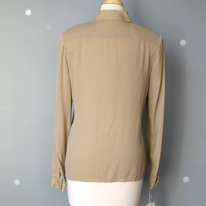 Simple silk gauze blouse by Carlisle from the 1980s in classic camel. Simple button down. This shirt has infinite versatility for work or casual looks with an old money vibe.<br />
Big shoulder pads<br />
Made in Hong Kong<br />
New with tags.  No flaws!<br />
<br />
Flat measurements:<br />
Shoulder to shoulder: 16<br />
Armpit to armpit: 20<br />
underarm sleeve seam: 18<br />
length: 26.25<br />
<br />
thank for looking!<br />
#45549