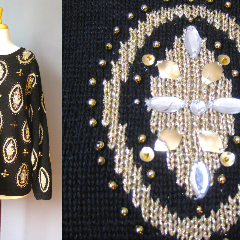 Gorgeous oversize vintage sweater in Black with a gold and clear plastic jeweled medallion pattern.
55% Ramie and 45% cotton
Marked size Medium but will fit a size large as well
Flat Measurements:
Shoulder to shoulder: 25.5
Armpit to Armpit: 22.75
Underarm sleeve seam length: 21
Length from back neck to hem: 27.25
width at hem unstretched: 22

Excellent condition!
#43192