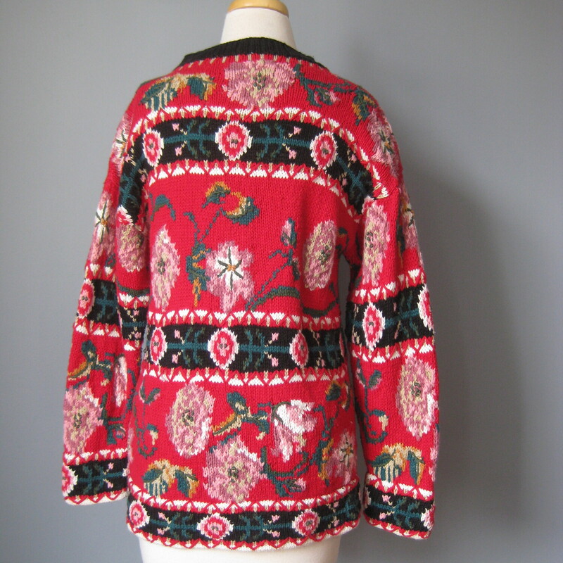 Long-ish cotton/ramie sweater with a pretty rose floral design in mostly black and red with pink and teal<br />
by CIE Compagnie Internationale Express<br />
Hand Knit<br />
<br />
Marked size S<br />
flat measurements:<br />
shoulder to shoulder: 19<br />
armpit to armpit: 19<br />
width at hem without stretching : 19<br />
length: 27<br />
<br />
thanks for looking!<br />
#45213