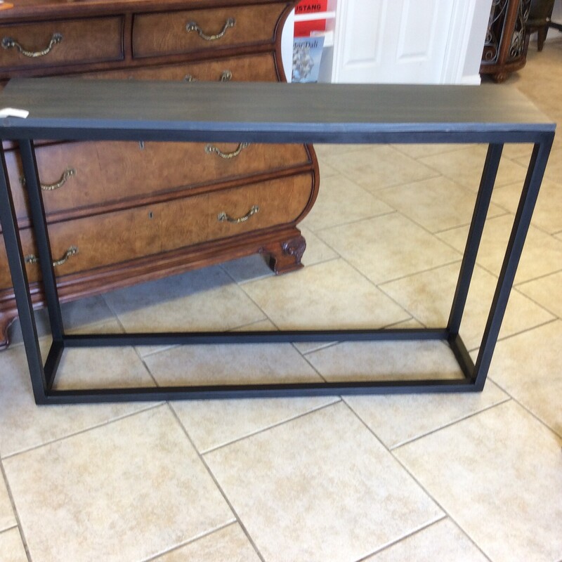 This sleek style entry table has a black wood base with a smoke gray stained top.