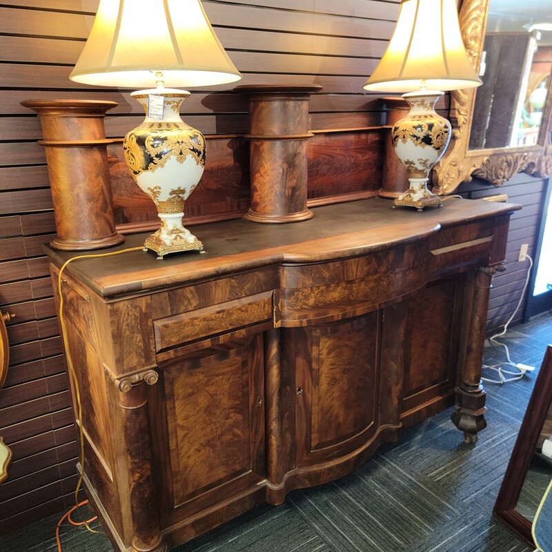 Huge Empire Mahogany Sideboard Circa 1830.  Has wear consistent with age.  Has gorgeous flame Mahogany veeners and molded columns.  Measures 70' long; 62' tall; w6' deep.