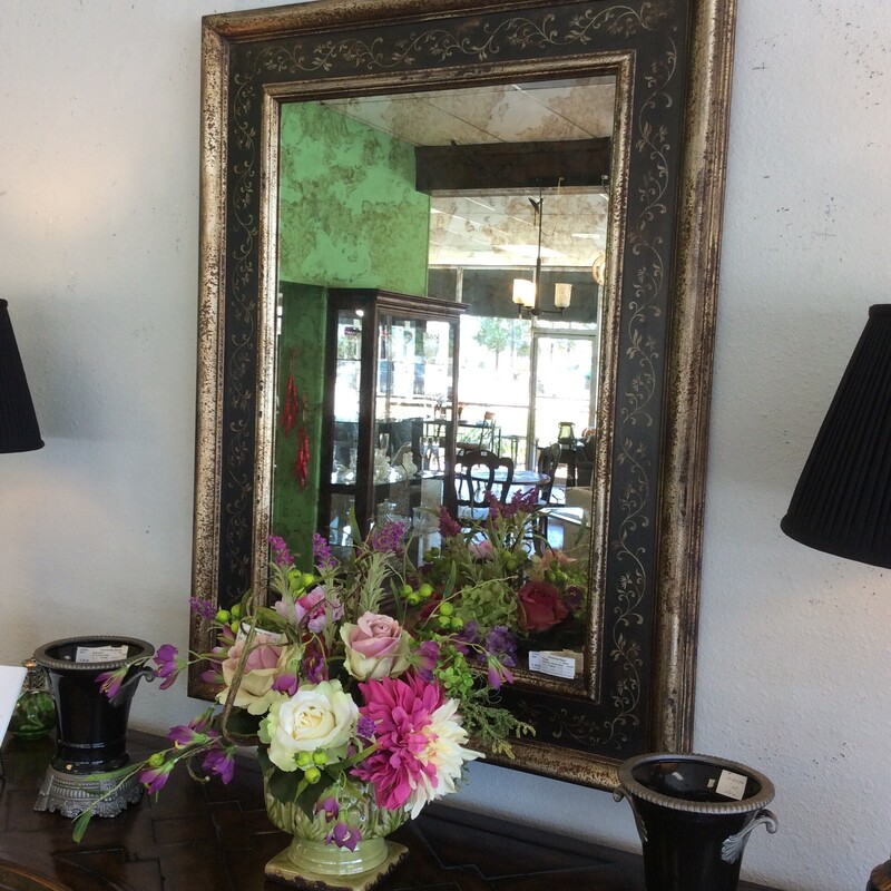Beautiful Distressed mirror with a Roma frame.