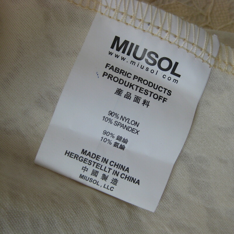 This pretty has a simple silouette.<br />
Fitted from shoulder to hip with a graceful skirt that reaches the floor.<br />
creamy ivory lace throughout, fully lined except above the bust.<br />
deep v in the back<br />
<br />
It's by Miusol and made of 90% nylon and 10% spandex, which gives it a nice amount of stretch.<br />
You'll want this to hug the curves, the measurements provided are taken with the garment lying flat and not stretched out at all.<br />
<br />
Here are the flat measurements, please double where appropriate:<br />
<br />
Armpit to armpit: 17.5<br />
Waist: 14.5<br />
Hip: up to 18<br />
Length: 57<br />
<br />
Excellent condition.<br />
<br />
<br />
Thanks for looking!<br />
#45442