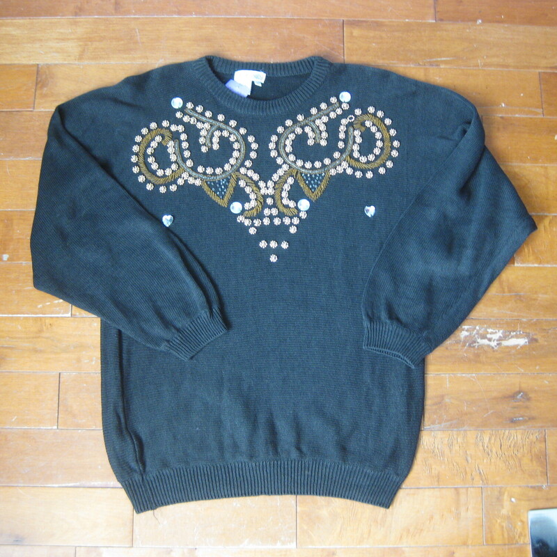 Gorgeous vintage sweater in Black with a scroll design done in coppery goldish beads and a few big jewels. By Lauren Allen<br />
55% Ramie and 45% cotton<br />
Marked size Large<br />
Flat Measurements:<br />
Armpit to Armpit: 23<br />
Underarm sleeve seam length: 20<br />
Length from back neck to hem: 26<br />
width at hem unstretched: 16<br />
<br />
Excellent condition!<br />
#43199