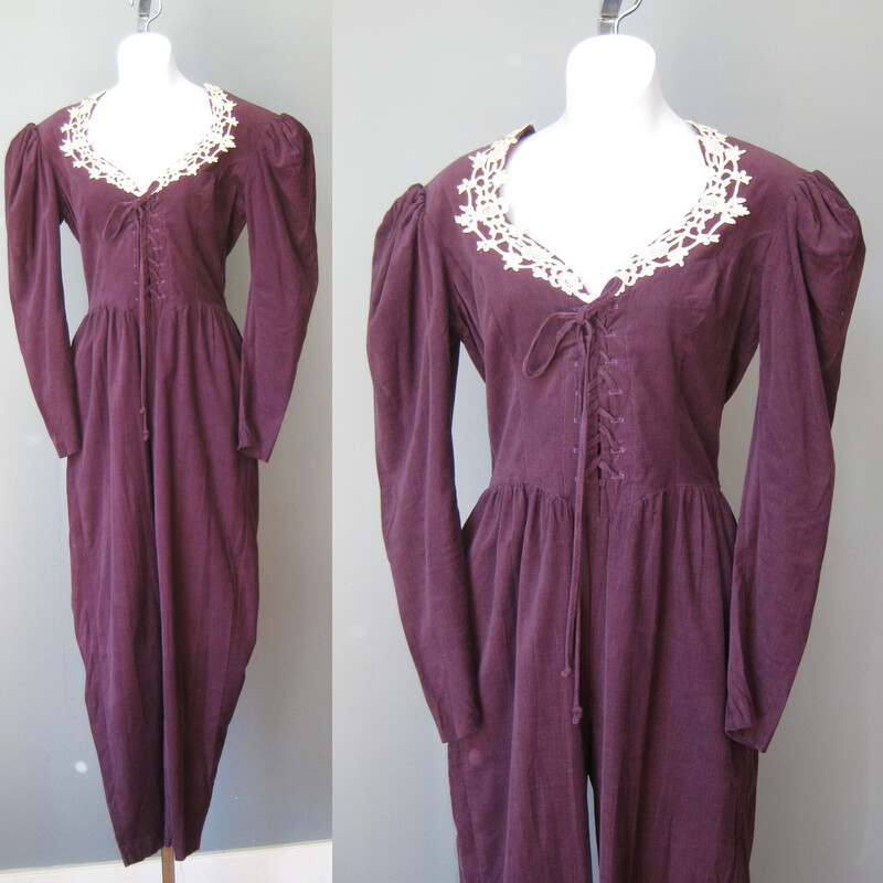 Gunne Sax Baby Cord, Purple, Size: 7
This pretty Gunnie Sax by Jessica jumpsuit is done in a terrific grape colored baby corduroy.
100% cotton no stretch
Made in the USA
It has ecru lace trim at the neck
pockets on each side
corset lacing cetner front
zipper in the back
Shoulder pads
Unline

Marked size 7
Here are the flat measurements
Shoulder to shoulder: 15
Armpit to Armpit: 17
waist: 13.5
hips: 20
Rise: aprox.  33 (measured from neck seam to crotch seam)
inseam: 28
Excellent condition! no flaws!  lace is mellow but even, it was probably a lighter cream when it was brand new
thanks for looking!
#60293