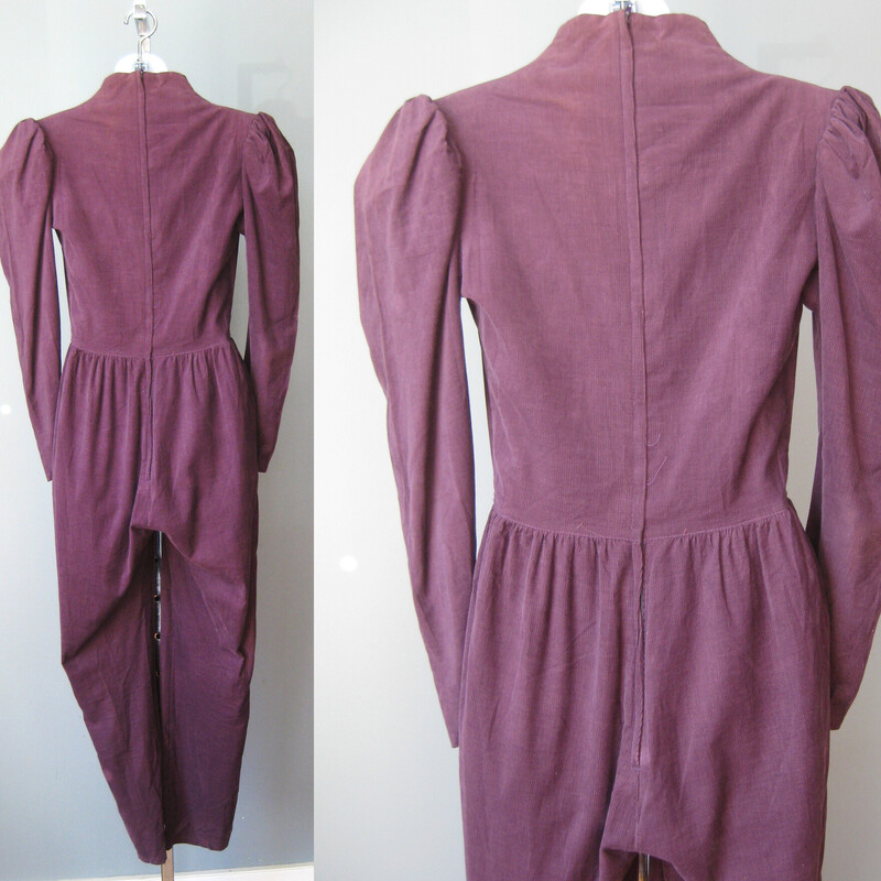 Gunne Sax Baby Cord, Purple, Size: 7<br />
This pretty Gunnie Sax by Jessica jumpsuit is done in a terrific grape colored baby corduroy.<br />
100% cotton no stretch<br />
Made in the USA<br />
It has ecru lace trim at the neck<br />
pockets on each side<br />
corset lacing cetner front<br />
zipper in the back<br />
Shoulder pads<br />
Unline<br />
<br />
Marked size 7<br />
Here are the flat measurements<br />
Shoulder to shoulder: 15<br />
Armpit to Armpit: 17<br />
waist: 13.5<br />
hips: 20<br />
Rise: aprox.  33 (measured from neck seam to crotch seam)<br />
inseam: 28<br />
Excellent condition! no flaws!  lace is mellow but even, it was probably a lighter cream when it was brand new<br />
thanks for looking!<br />
#60293