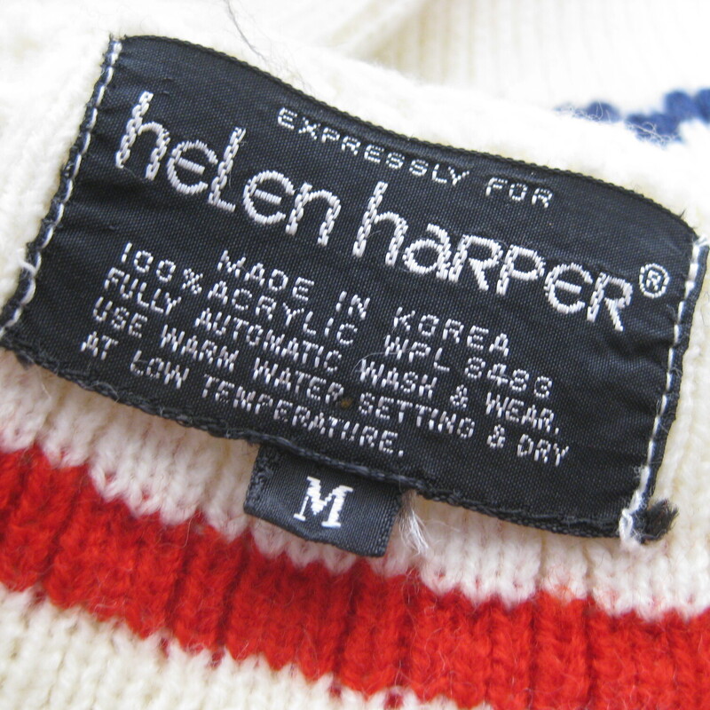 Vtg Helen Harper Striped, White, Size: Medium<br />
cute long sleeved pullover sweater from the 1970s<br />
It has lacing at the quarter length v-neck opening<br />
red and blue geometric stripes on an ivory background<br />
made in Korea for the brand Helen Harper<br />
<br />
Marked Size M<br />
flat measurements:<br />
shoulder to shoulder : 15<br />
armpit to armpit: 18<br />
length: 24<br />
width at hem: 18<br />
underarm sleeve seam: 18<br />
<br />
knitted with acrylic yarn with a good bit of stretch.<br />
<br />
Excellent condition!  the back of one sleeve has a little brown area as shown, very faint!<br />
<br />
thanks for looking!<br />
#53556