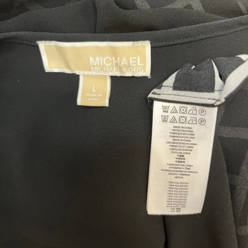 Michael Kors Sheer Blouse<br />
Zipper Accent<br />
Black and White<br />
Size: Large