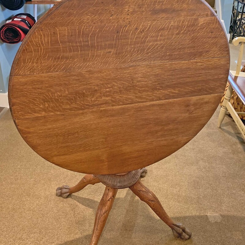 Antq Tilt Top Oak Table,
with Hand Carved Claw Feet & Legs
Size: 36in W x 30 in H
This is a beautiful table - excellent condition with
great character.
