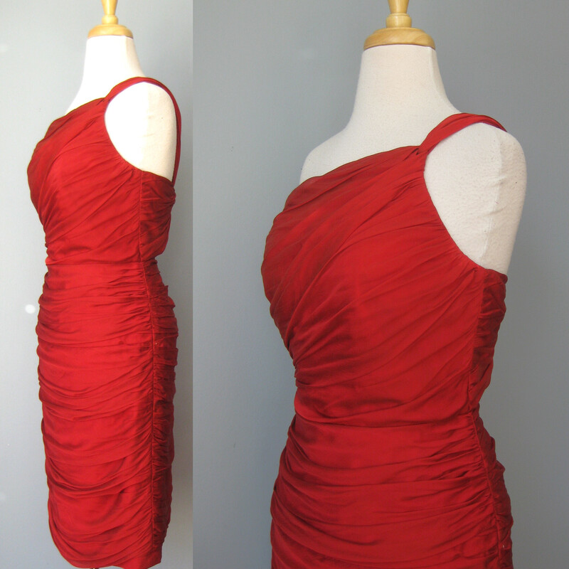 Carmen Valvo Silk Bandge, Red, Size: 6
You will have them in the palm of your hand whether you are coming or going in this killer designer cocktail dress in deep red silk.
It's tight
It's FLIRTING with 'too much' in terms of skin showing but it's definitely on the right side of the line

Beause it's not shiny (the silk is matte) or bright (the red is deep, almost brick red with no brown in it) or too short (probably below the knee on most women) and it's so beautifully executed that it gives luxe, daring but not tacky.
So pour yourself in, stand up straight and work it!

By Carmen Marc Valvo

100% silk.
Fully lined
NO stretch.
The bodice has a bit of boning
Center back zipper

Marked size 6, but might fit smaller at the bust
Armpit to armpit: 17.75
Waist: 14.75
Hip: 18.5
Length: 39

Like new condition.

Thanks for looking!
#54808