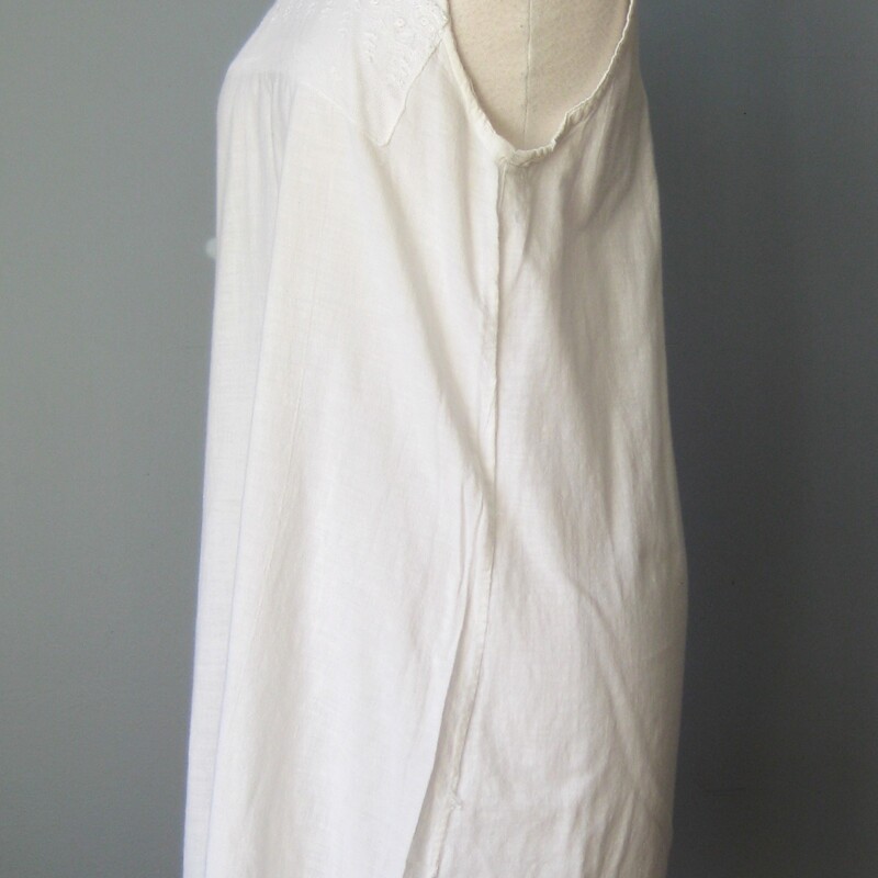 Edwardian Cotton Chemise, White, Size: Small
Period Edwardian Cotton chemise, orginally intended as a under garment layer.
Made of lightweight cotton it's very simple with a panel of fancy netting across the uppder chest.
This shoulder straps have been folder and sewn so if you wish for it to sit lower on the chest you could easily release that stitching for an extra inch or so of length there.
No closure
 The woven cotton fabric is soft and lightweight, in excellent condition with a very few minor and tiny spots as shown.
One of the side seams needs a few stitches, I can do this repair before I ship it if you like, just please remind me.

Here are the flat measurments:

armpit to armpit: 18
across the waist area: about 20
hips: about 23
length: 35.5

I am not an expert in this period but certainly appreciate it very much.  If you have any info to share about this piece please don't hesitate to message me.  I would be very grateful!  I have a couple more of these dresses and a few cropped shirts to share soon so please visit again!

Thanks for looking!
#53846