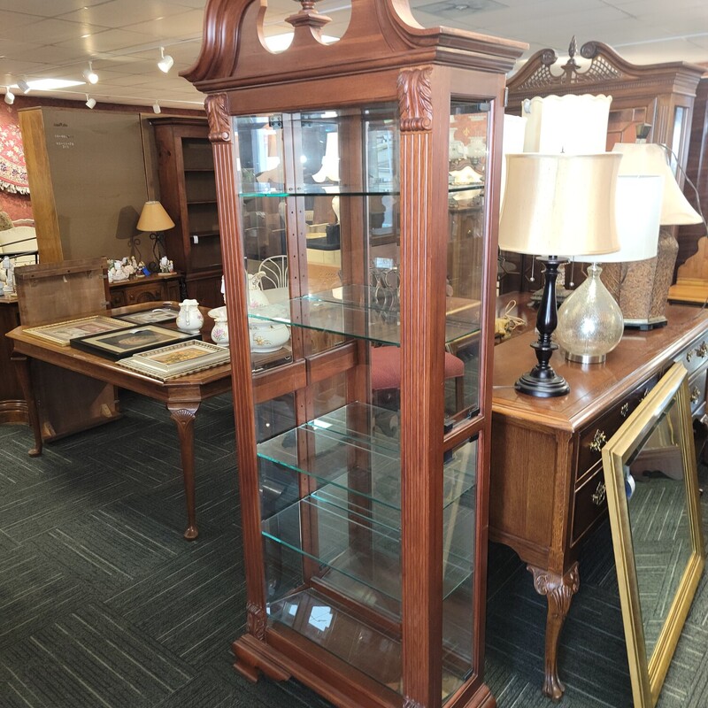 Modern Curio  Cabinet by Vineyard  in excellent condition.  Has 4 plate glass shelves; built in lighting & side access on both sides.  Measures 80' tall; 30' wide; 13' deep.  Qaulity piece!