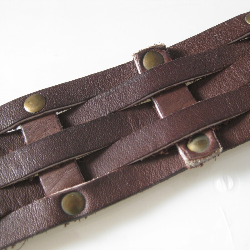 V Vtg Suede & Brass Belt, Brown, Size: None<br />
Cool leather belt of strips of rawhide brown leather woven together and joined by brass studs.<br />
The buckle slides along the length (doesn't have a prong) and is made of hammered and antiqued brass.<br />
Gives middle ages!<br />
<br />
<br />
Length: 36<br />
Width: just under 2<br />
<br />
no marks<br />
<br />
thanks for looking!<br />
#963