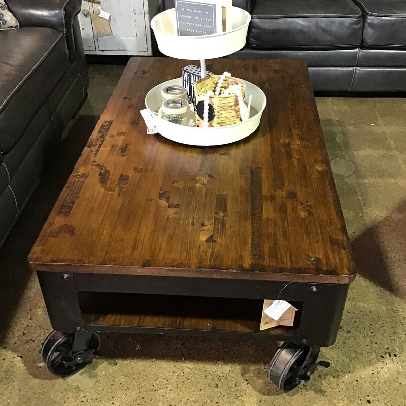 This industrial design coffee table features large lockable metal wheels and a lift-top for when you are working from home or grabbing a bite to eat while you are watching the game! The top is rustic and in great shape.
Dimensions with the top down are 48 in x 28-1/2 in x 18-1/2 in
Dimensions with the top up are 48 in x 28-1/2 in x 26 in
