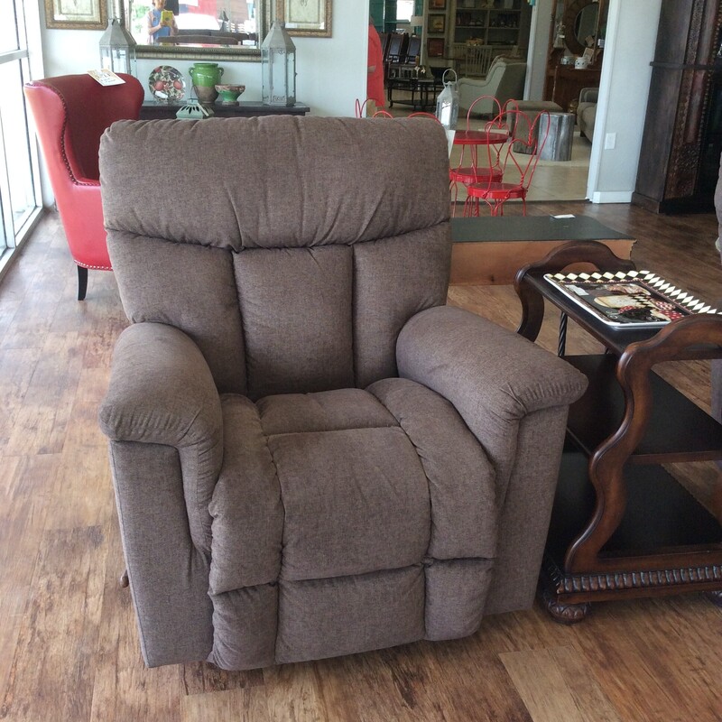 This is a very nice recliner by LazyBoy. Oversized and overstuffed, it's been upholstered in a lovely light brown.
Manual operation. We have 2 of them priced separately.