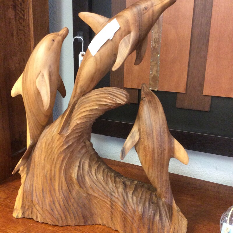 This is a beautiful Balinese wood carving of three frolicking dolphins.