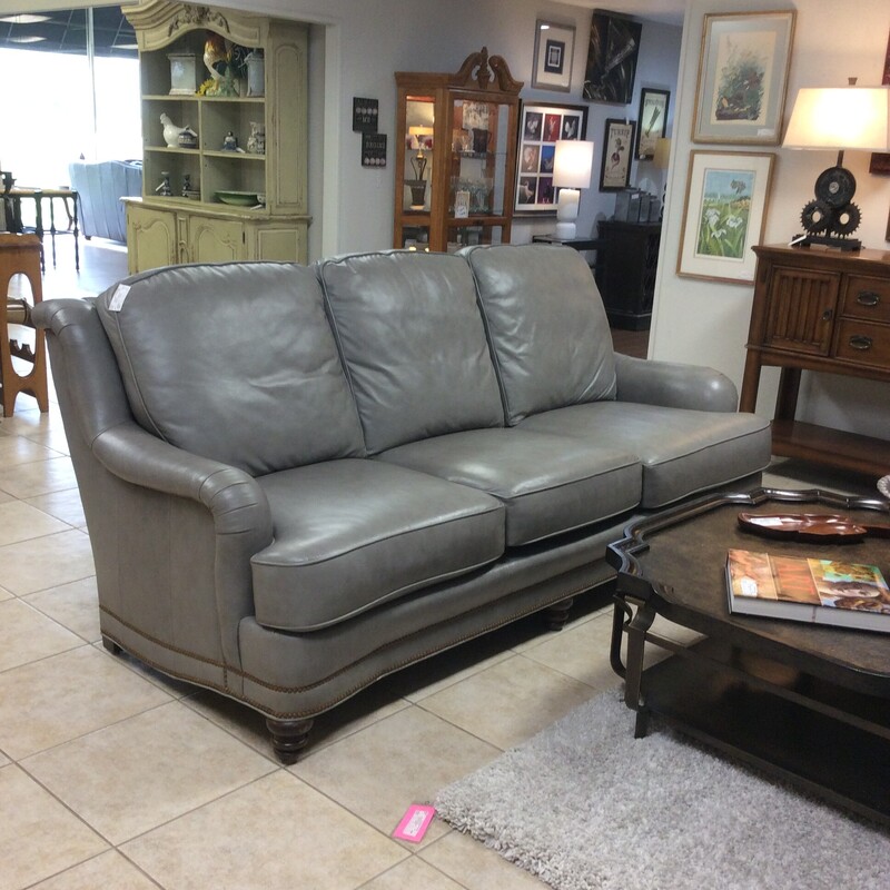 This is a gorgeous sofa from Whittemore-Sherrill. Upholstered in gray leather with a nailhead trim.