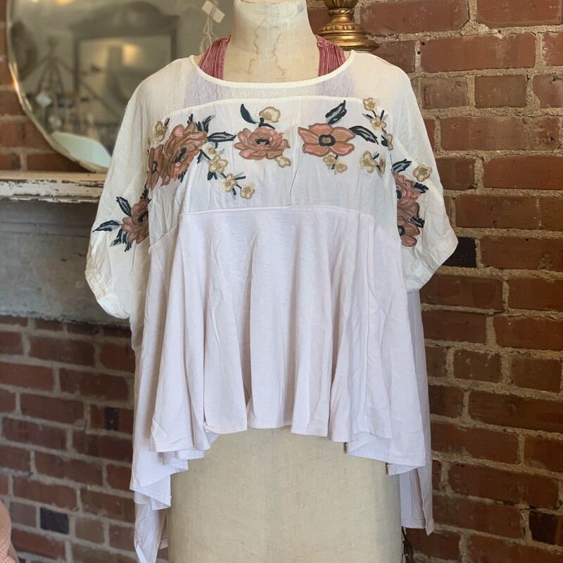 These tops are just beautiful! The floral embroidery is the perfect whimsical touch to this super wearable shirt!