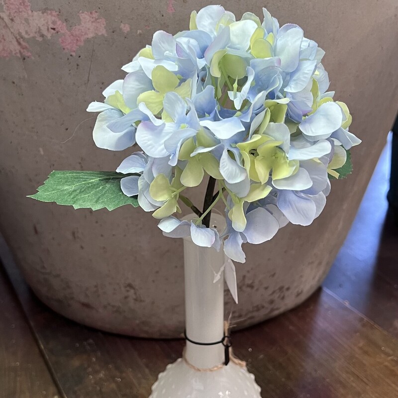 This pretty soft blue hydrangea has fabric petals and leaves with a plastic stem.  Hydrangea measures 13 inches tall and looks beautiful alone in any vase or grouped with any  floral arrangement