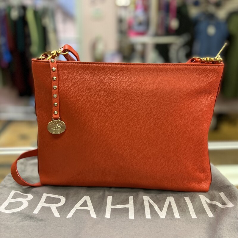 BRAHMIN<br />
Brahmin All Day Convertible Crossbody Bag<br />
* Tango Orange Nepal Leather<br />
* Gold Tone Hardware<br />
* Soft Beige Lining with Brahmin Logo<br />
* Zipper Top Closure<br />
* Interior features one zip pocket, two slip pockets, two pen holders,  and one key leash<br />
* One exterior slip pocket with strap closure<br />
* 14\"-23\" Shoulder Drop<br />
* Dimensions: 9\" High x 12\" Wide<br />
Comes with the original dust cover & Registration card<br />
In like new condition, no marks or flaws.