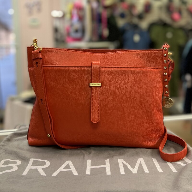 BRAHMIN
Brahmin All Day Convertible Crossbody Bag
* Tango Orange Nepal Leather
* Gold Tone Hardware
* Soft Beige Lining with Brahmin Logo
* Zipper Top Closure
* Interior features one zip pocket, two slip pockets, two pen holders,  and one key leash
* One exterior slip pocket with strap closure
* 14\"-23\" Shoulder Drop
* Dimensions: 9\" High x 12\" Wide
Comes with the original dust cover & Registration card
In like new condition, no marks or flaws.
