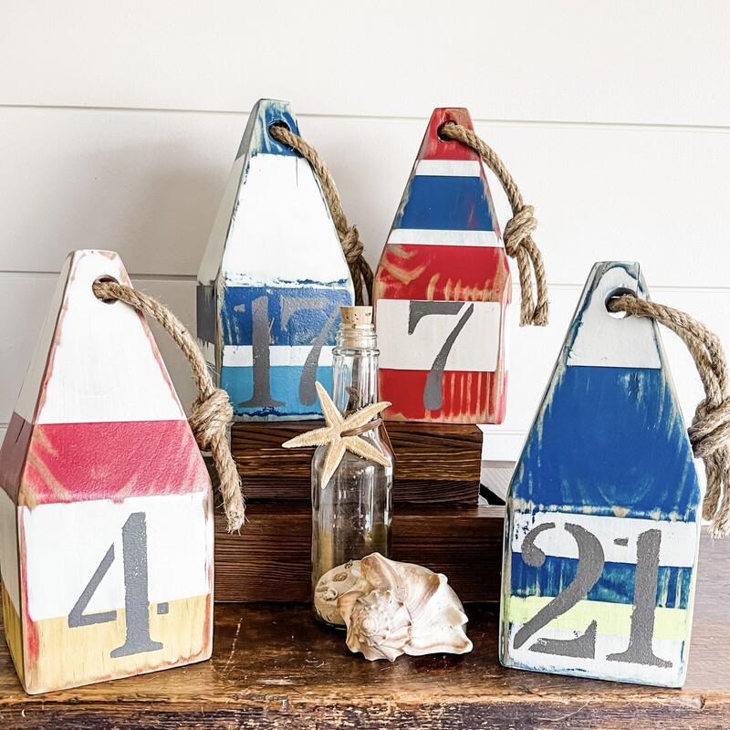 Our wood buoys make an awesome compliment to any nautical summer decor! Each buoy measures approximately 8' tall by 3.5' square and is hand cut and hand painted. No 2 designs will ever be exactly alike!