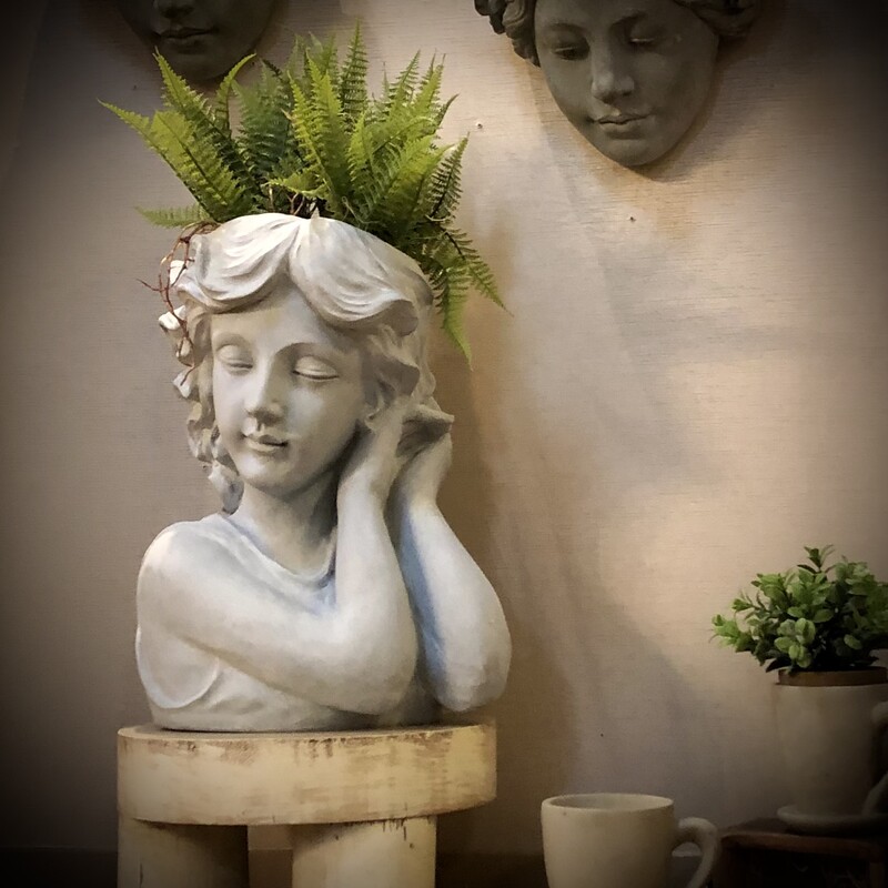 Young Girl Planter<br />
14.5H x 12 W x 9 D<br />
Isn't she beautiful?<br />
This girl-shaped planter is here to bring a touch of whimsy and personality to your plant collection. With her sleek lines and contemporary design, she's ready to become the centerpiece of any hip and trendy space.