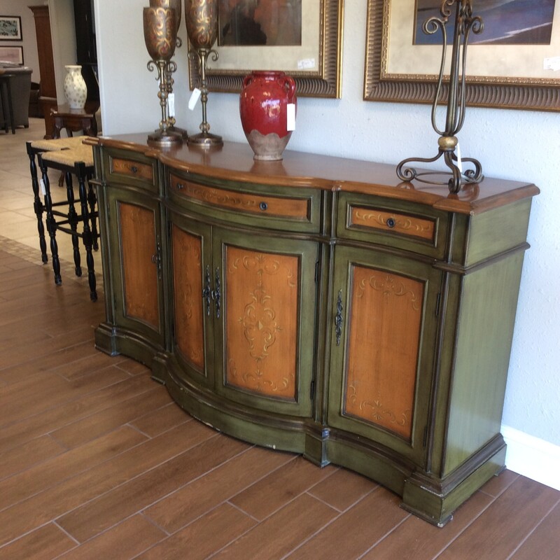This is a very nice Tuscan Buffet. The buffet has a beautiful green and tan wash painting, has 3 drawers and 3 cabinets with 1 shelf each.
