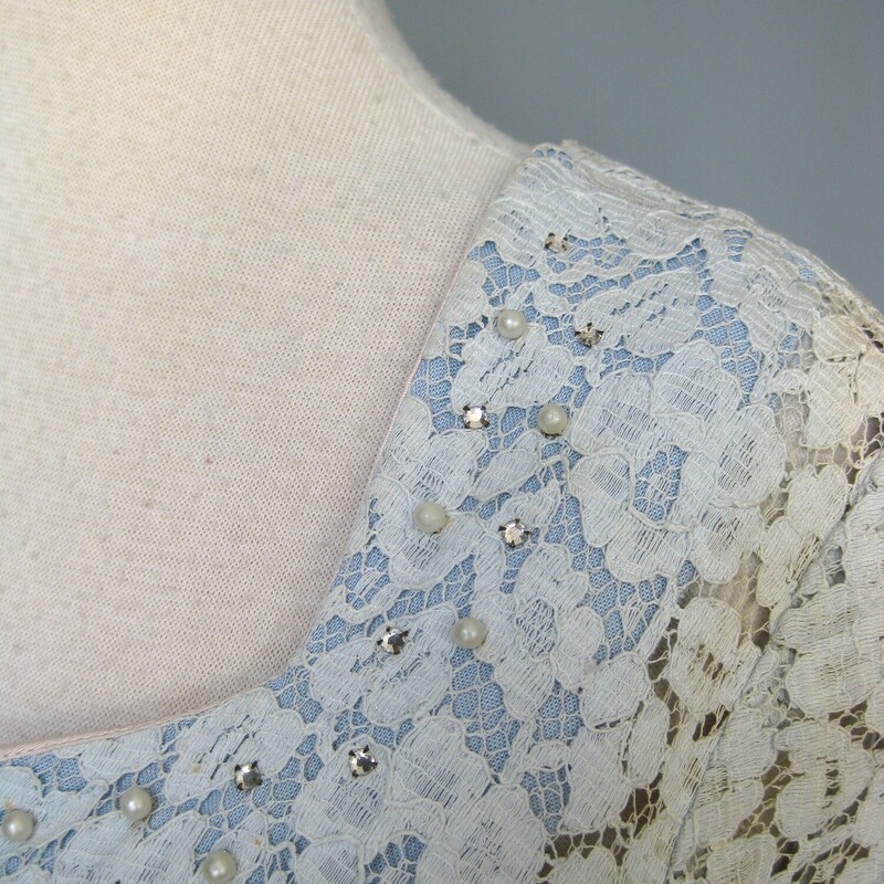 Vtg Lace W Pearls, Blue, Size: XS
Pretty lace cocktail dress from the 1950s.
Fitted bodice with short sleeves, the upper chest lined with blue facing and sprinkled with tiny pearls and silver metal set clear rhinestones.
the skirt very full.
Most of the dress is lined in a blush/flesh tone fabric.
Side metal zipper
No tags, it could be handmade as were quite of few of the evening dresses in the haul of which this dress is one piece.
great condition, I encourage you to add a crinoline!

Flat Measurements:
Armpit to Armpit: 18.5
Waist: 15.5
Hips: 20.5
Length: 44.5

Thank you for looking.
#47210