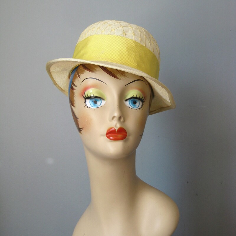Sweet little summer hat in organza and ribbon.<br />
Wide brim with a wide yellow ribbon and a white fabric flower<br />
<br />
Union label<br />
Made in the USA<br />
Condition:  Good shape but old, some grime. The wire around the outer edge of the rim is beginning to poke through, as shown.<br />
<br />
Quite Small!<br />
Inner hat band measures 2.75 inches around<br />
<br />
<br />
Thanks for looking!<br />
#1874