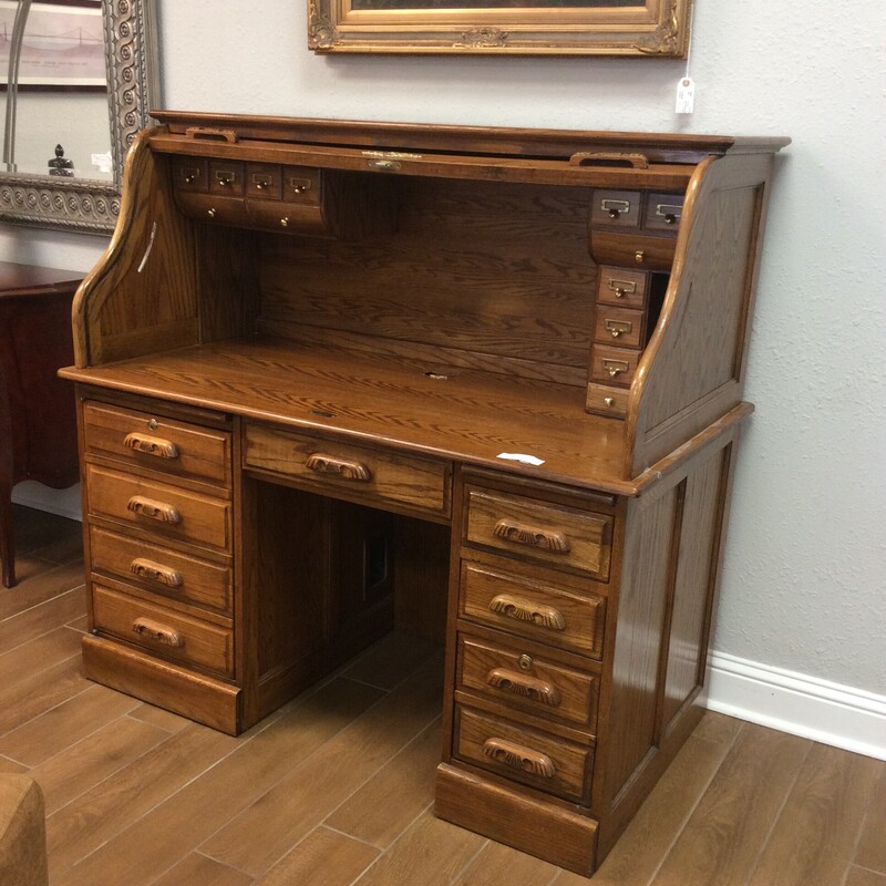 These don't last long here, so come by and take a look!<br />
This one is in good condition and includes all of the standard features plus some. There are cubbies, file holders, a pull-out tray, drawers and more. Key included.