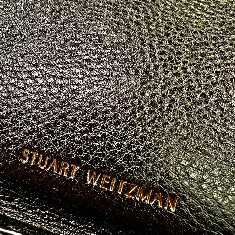 Stuart Weitzman<br />
<br />
PETITE LOLA' WHIPSTITCH EDGE LEATHER BAG<br />
Melding the best features of two coveted styles from Stuart Weitzman, this Petite Lola bag features an envelope-inspired structure hand-laced with whipstitched edges. Cinched with corset-inspired lacing at the side, this holdall features an optional shoulder strap that can be slung over the shoulder or carried as a clutch.<br />
<br />
-Black grainy leather<br />
-Hand-laced whipstitching<br />
-Detachable buckled shoulder strap<br />
-Front flap with magnetic snap closure<br />
-Slip pocket under flap<br />
-Interior zip pocket and slip pocket<br />
-'Micro Black Ultra' suede lining<br />
-100% Leather<br />
Original retail price: $495.00<br />
This bag is in like new condition, no marksor flaws.